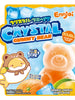 Sachet d'oursons en gélatine Ennjoi Crystal Gummy Bear, double saveur orange + mangue, poids net 70g. L'emballage présente un petit ourson mignon avec une mangue et un grand ourson cristallin, avec des glaçons et des fruits frais illustrés