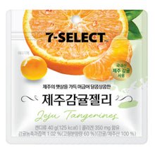 Emballage de la Gelée de Mandarine de Jeju « 7-Select » , une confiserie coréenne au collagène et au jus de mandarine de l'île de Jeju. Le paquet illustre une mandarine juteuse et une gelée ronde sur fond blanc, avec les logos 7-SELECT et Jeju Tangerines.